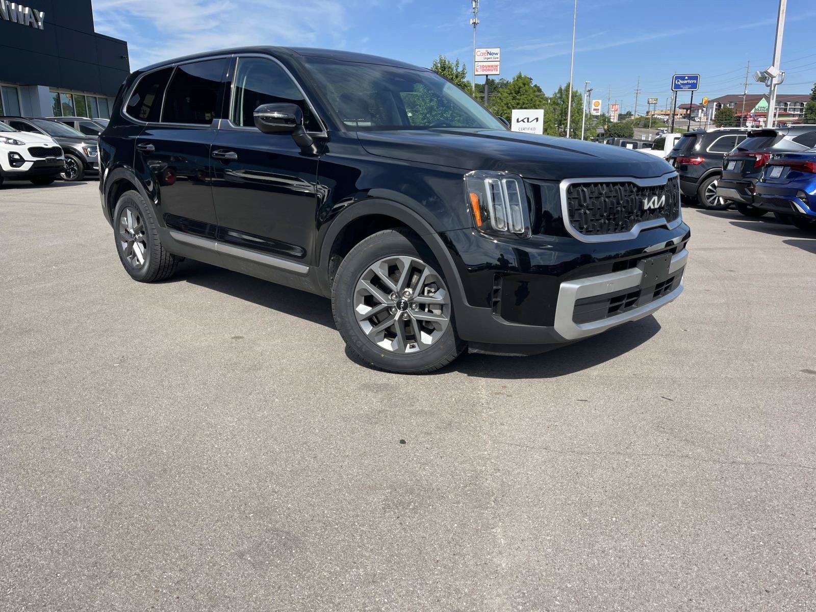 Used 2024 Ebony Black Kia LX image 1