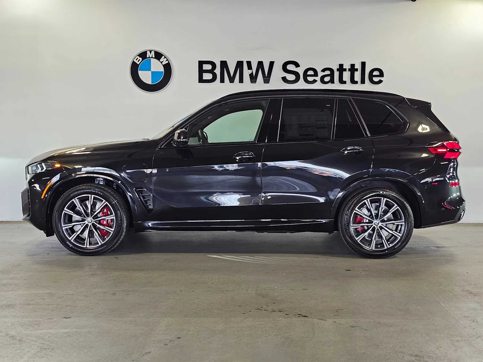 New 2026 Black Sapphire Metallic BMW xDrive50e image 3