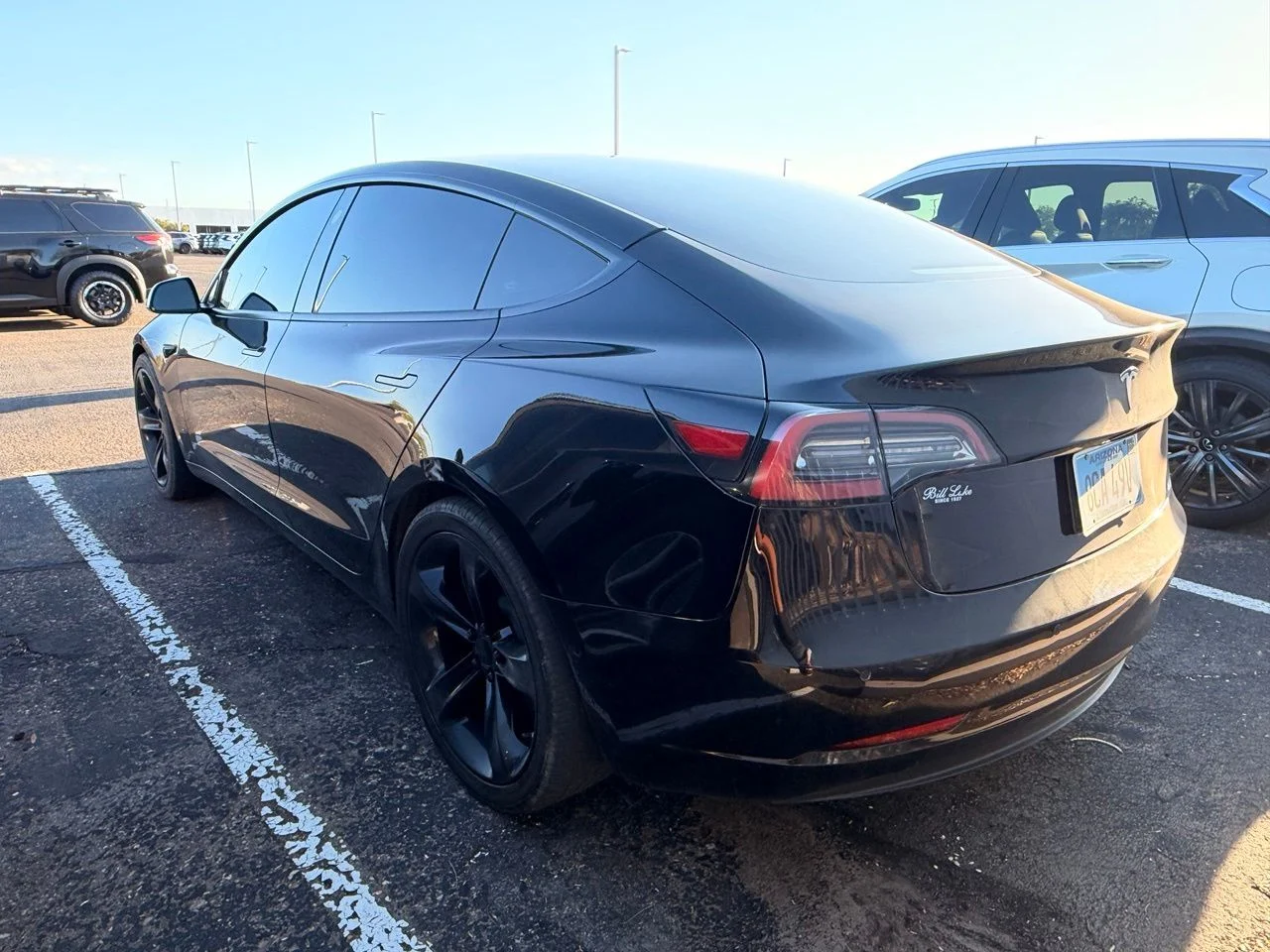Used 2022 Solid Black Tesla Base image 6