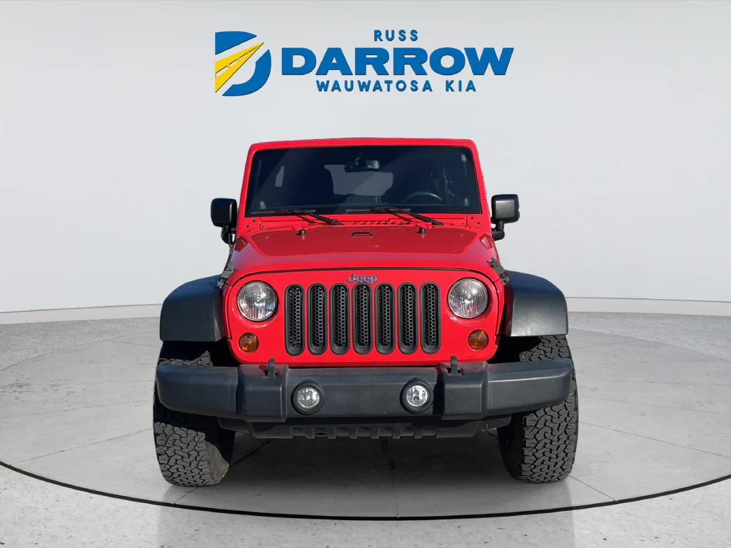 Used 2013 Red Jeep Unlimited Sport image 8