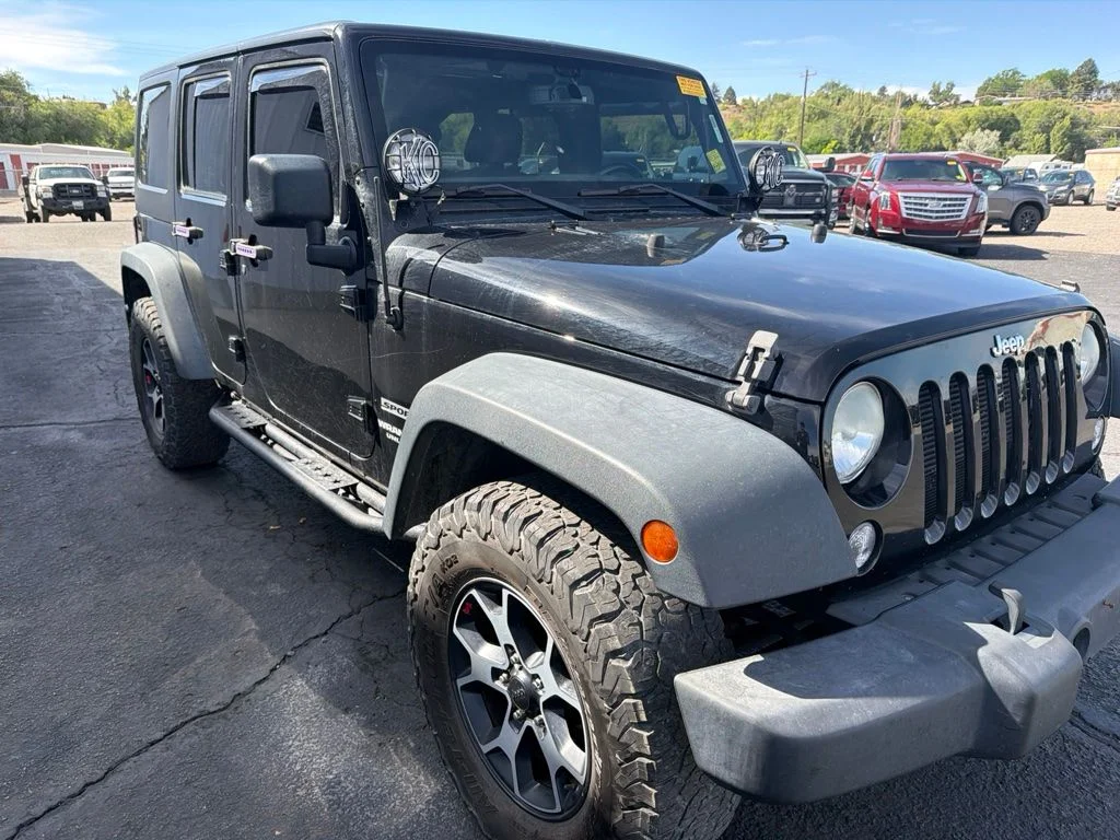 Used 2014 Black Clearcoat Jeep Unlimited Sport image 1
