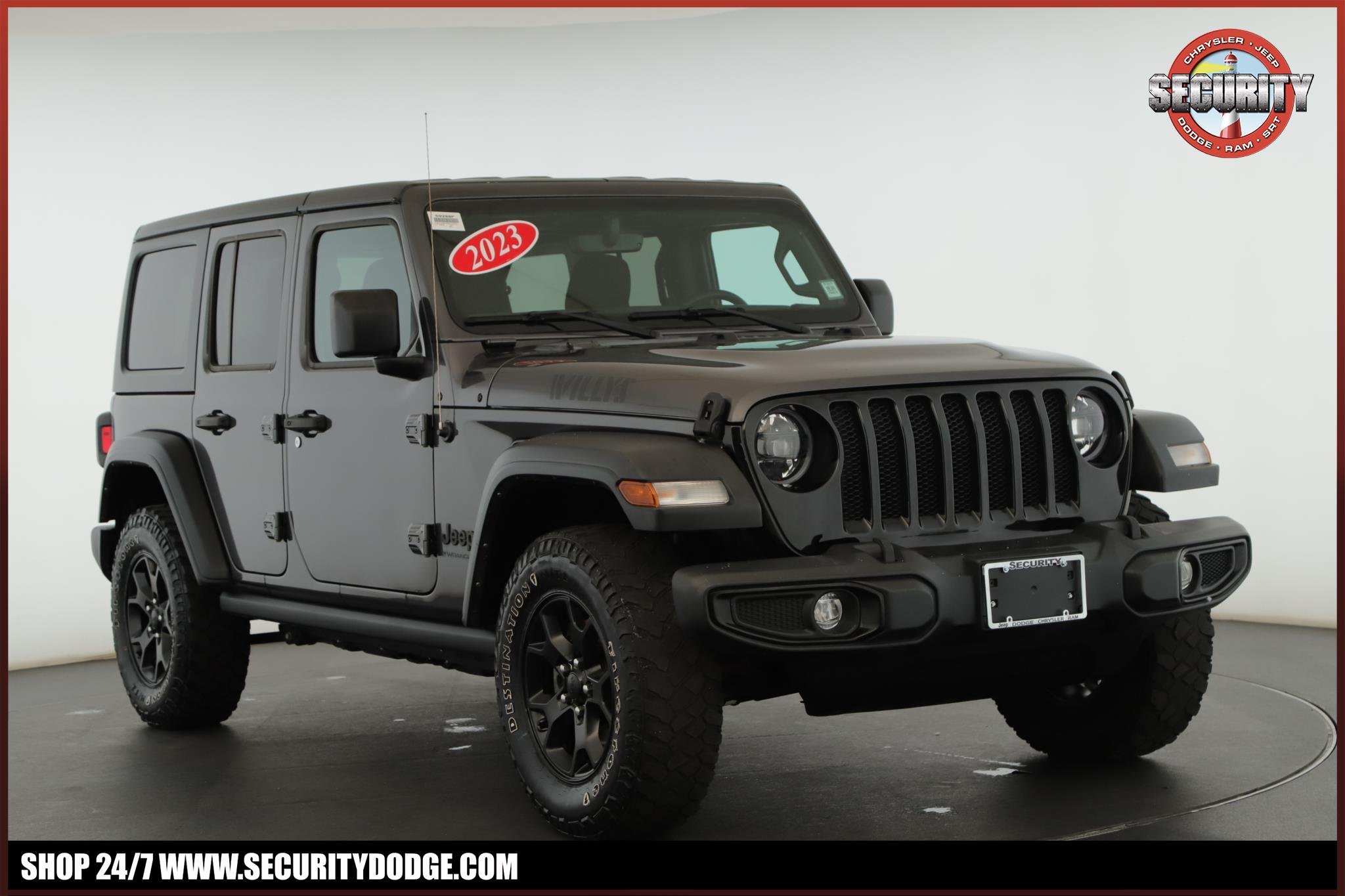 Used 2023 Granite Crystal Metallic Clearcoat Jeep Willys 4 Door 4x4 image 1