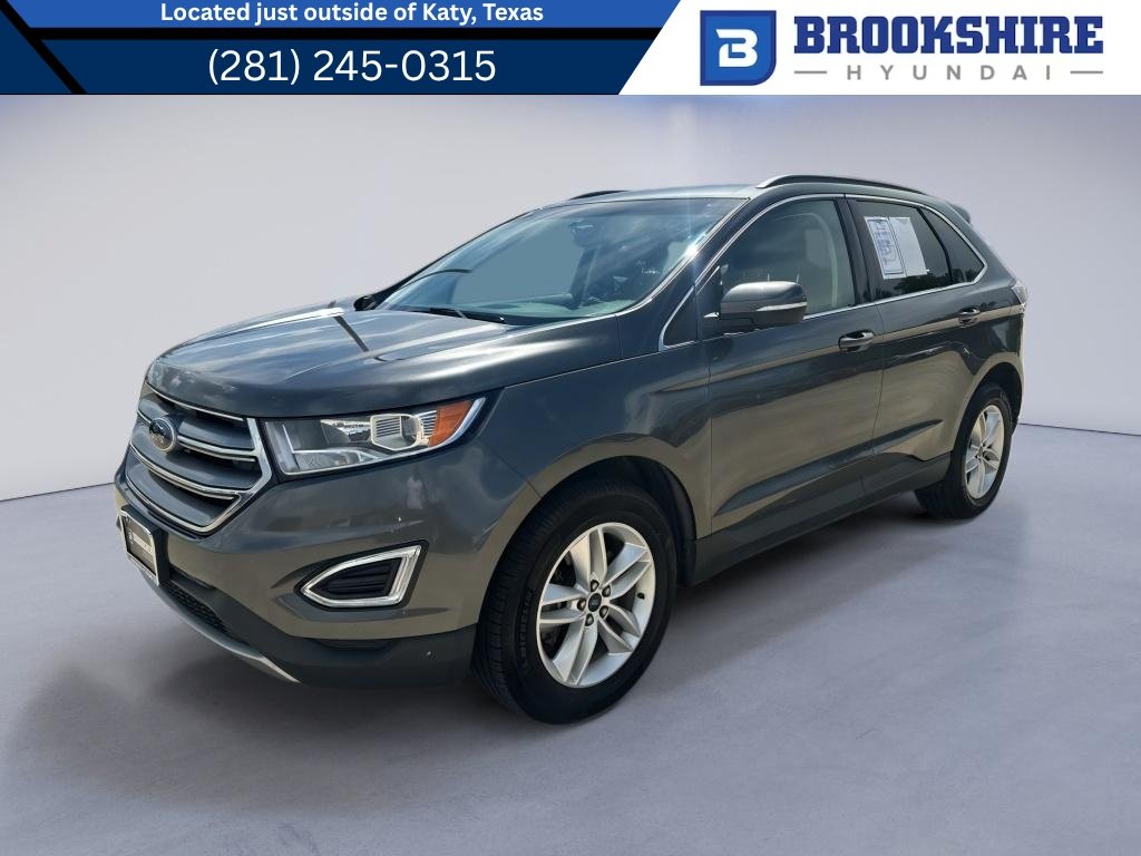 Used 2017 Magnetic Metallic Ford SEL image 1