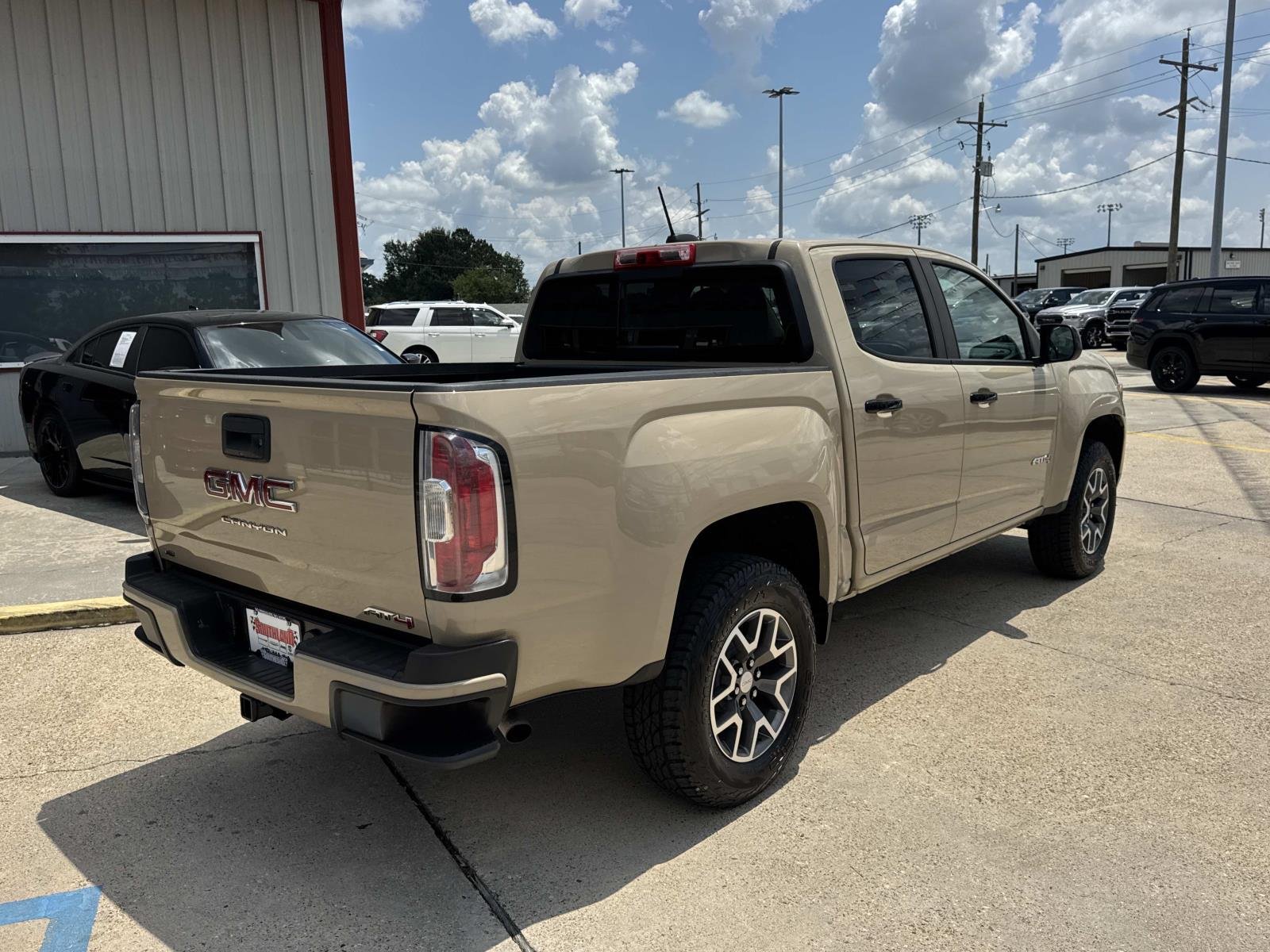 Used 2022 Desert Sand Metallic GMC 4WD AT4 w/Cloth image 7