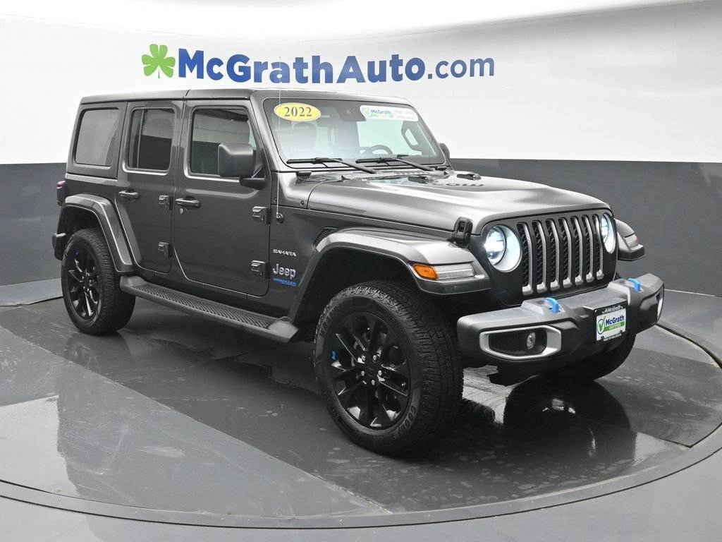 Used 2022 Jeep Wrangler Unlimited Sahara 4XE with VIN 1C4JJXP65NW245627 for sale in Cedar Rapids, IA