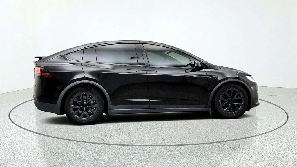 Used 2023 Solid Black Tesla AWD image 4