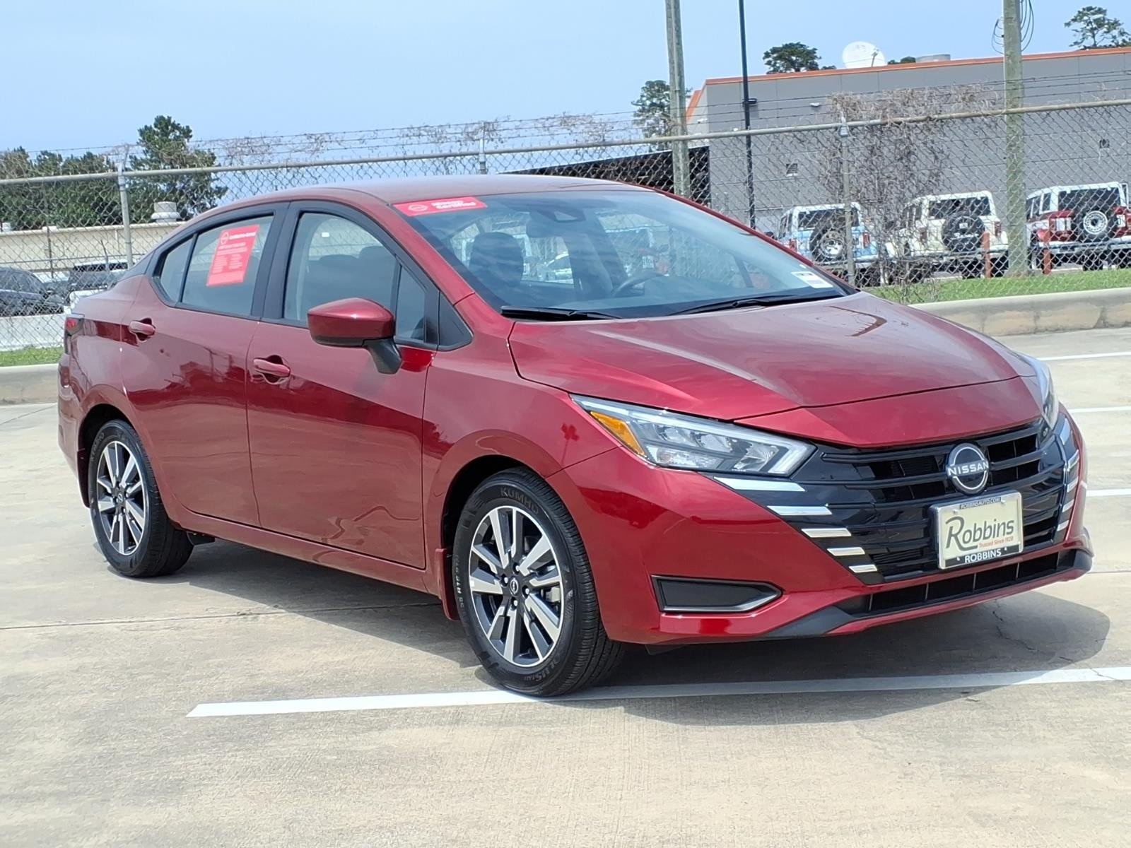 2025 Nissan Versa SV Red at Robbins Nissan