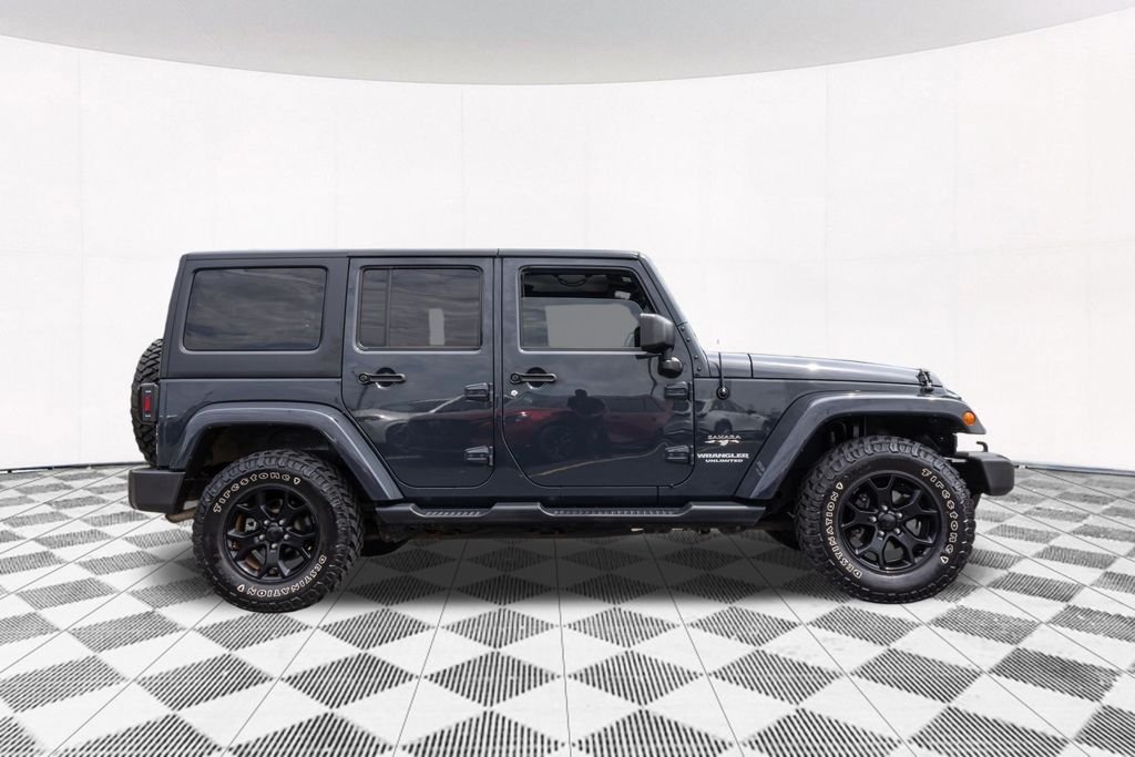 Used 2017 Black Jeep Unlimited Sahara image 11