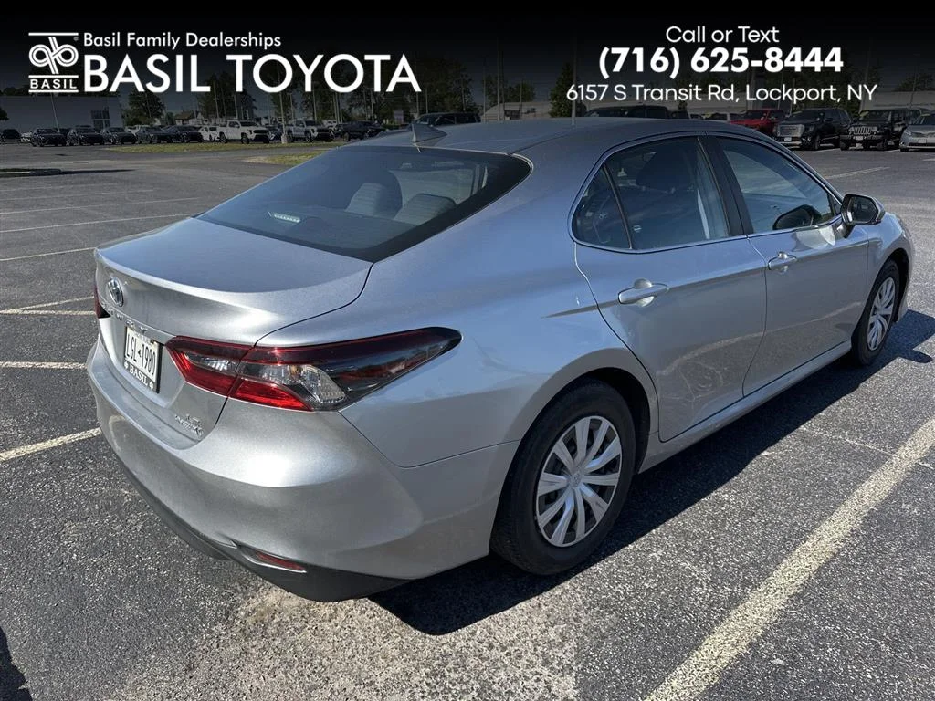 Used 2024 Celestial Silver Metallic Toyota Hybrid LE image 1