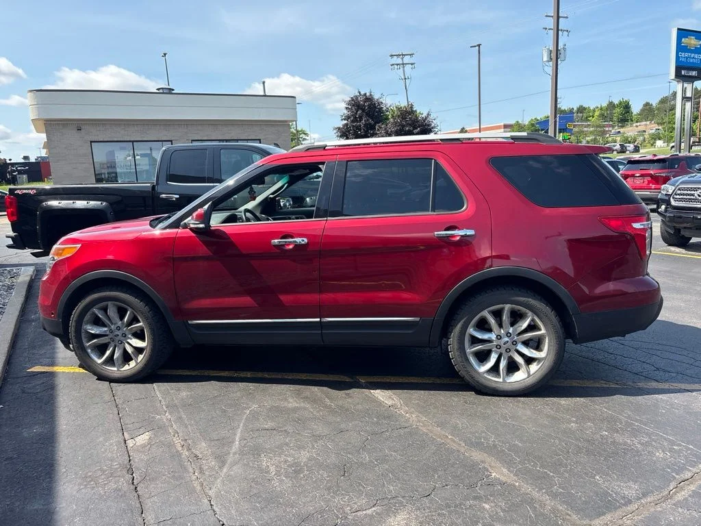 Used 2013 Ruby Red Metallic Ford Limited image 1