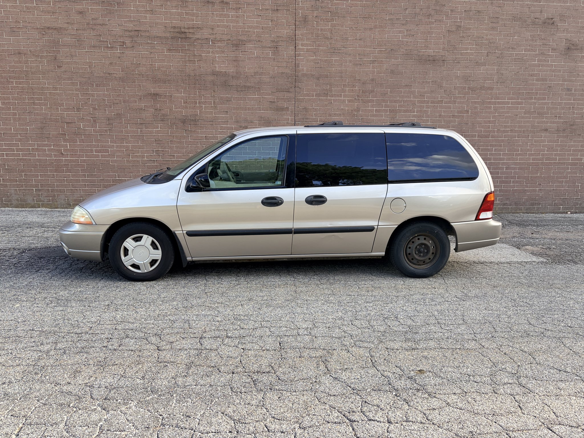 Used 2003 Silver Frost Clearcoat Metallic Ford LX image 2