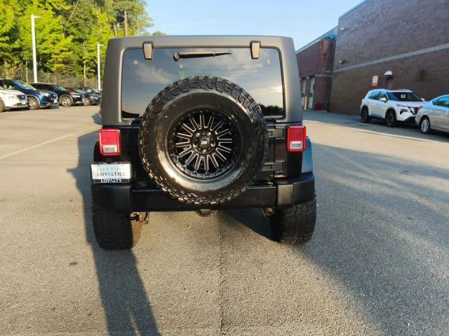 Used 2018 Black Jeep Unlimited Sahara image 5