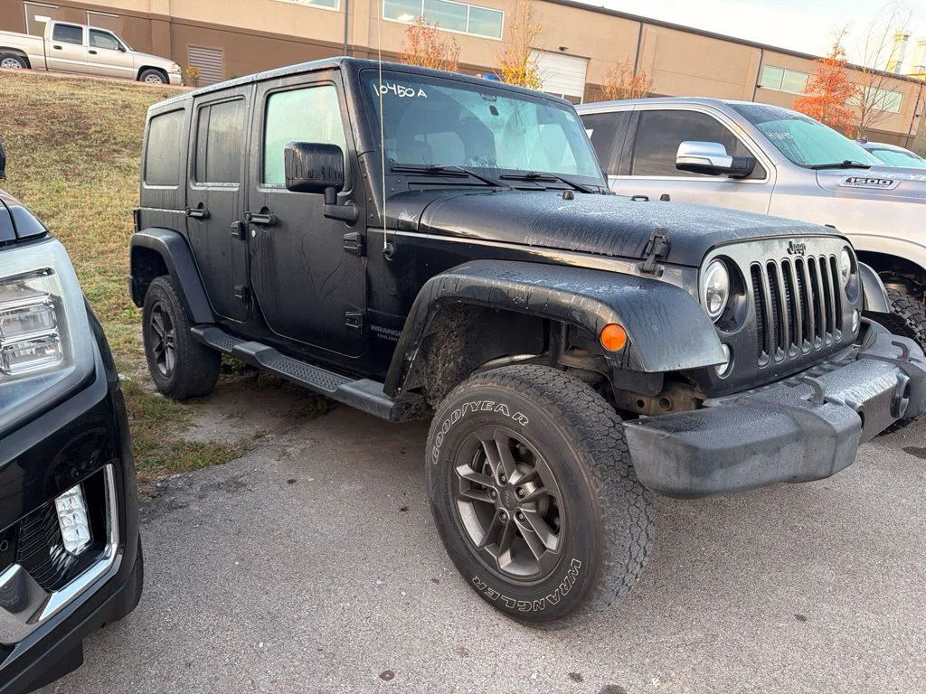 Used 2014 Black Clearcoat Jeep Unlimited Sahara image 1