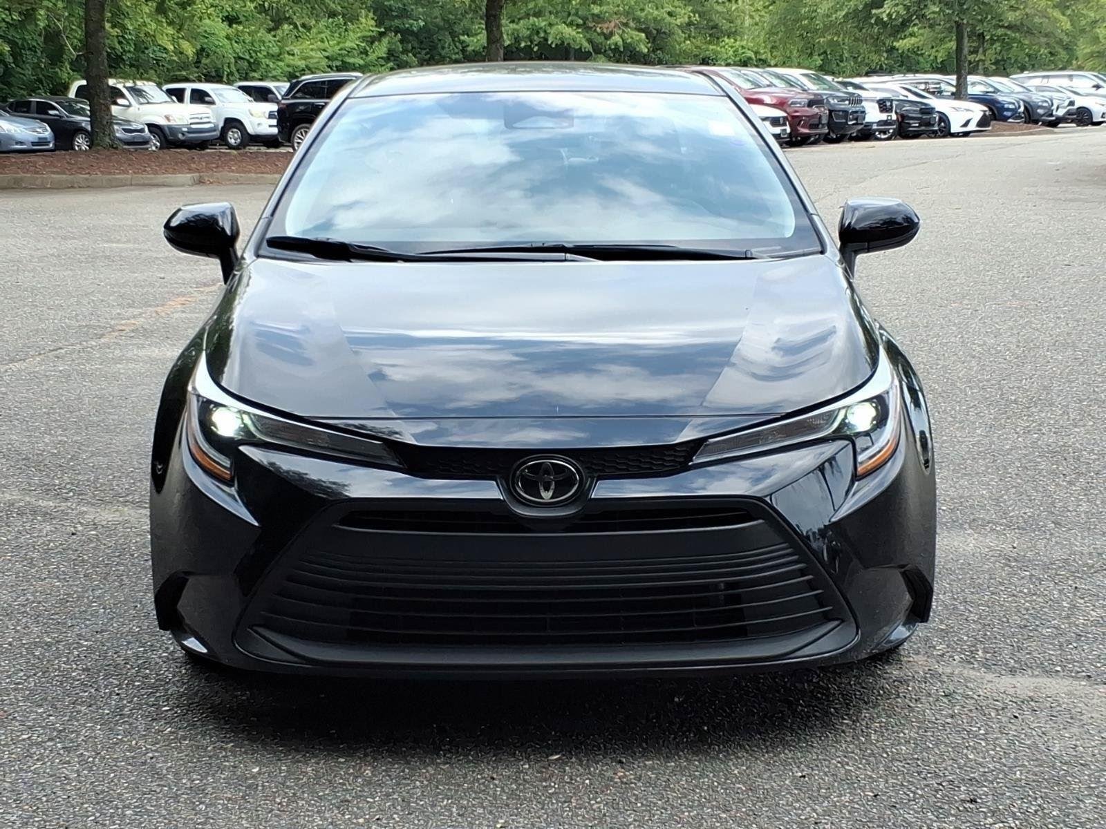 Used 2025 Midnight Black Metallic Toyota LE image 2