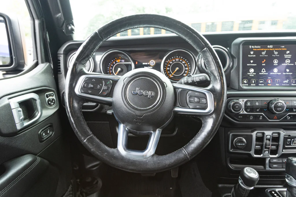 Used 2020 Black Jeep Unlimited Sahara Altitude image 18