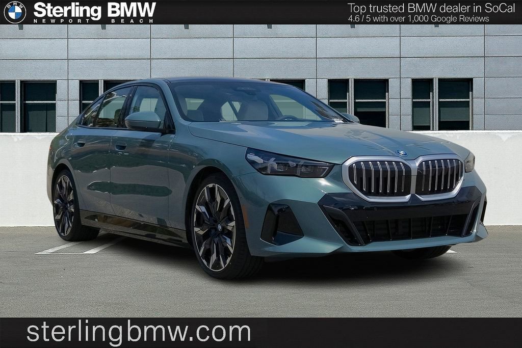 New 2026 Cape York Green Metallic BMW 550e xDrive image 1