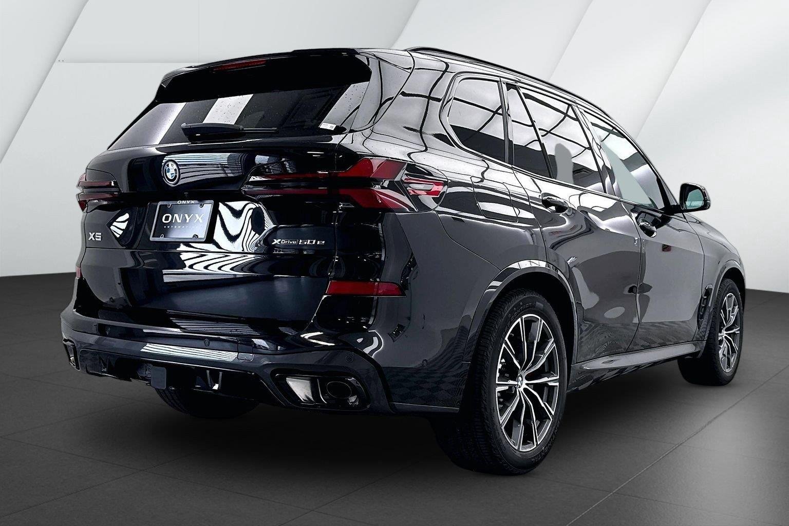 New 2026 Black Sapphire Metallic BMW xDrive50e image 6