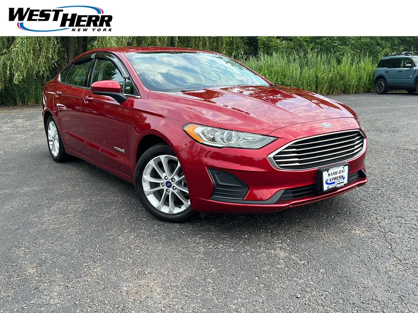Used 2019 Ruby Red Metallic Tinted Clearcoat Ford SE image 1