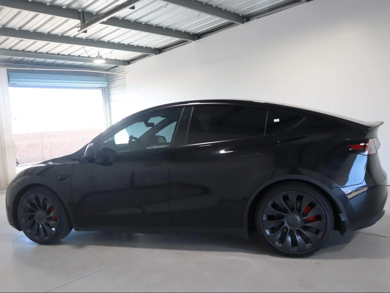 Used 2024 Solid Black Tesla Performance image 8