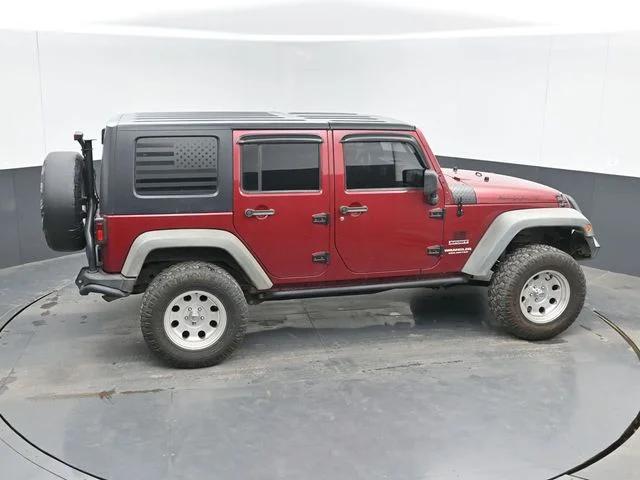 Used 2012 Red Jeep Unlimited Sport image 23