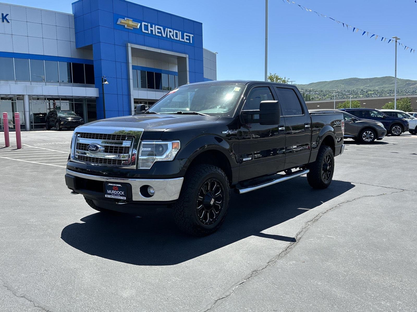 Used 2014 Ford F-150 XLT with VIN 1FTFW1ET2EFA19008 for sale in Woods Cross, UT