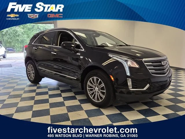 Used 2019 STELLAR BLACK METALLIC Cadillac Luxury FWD image 1