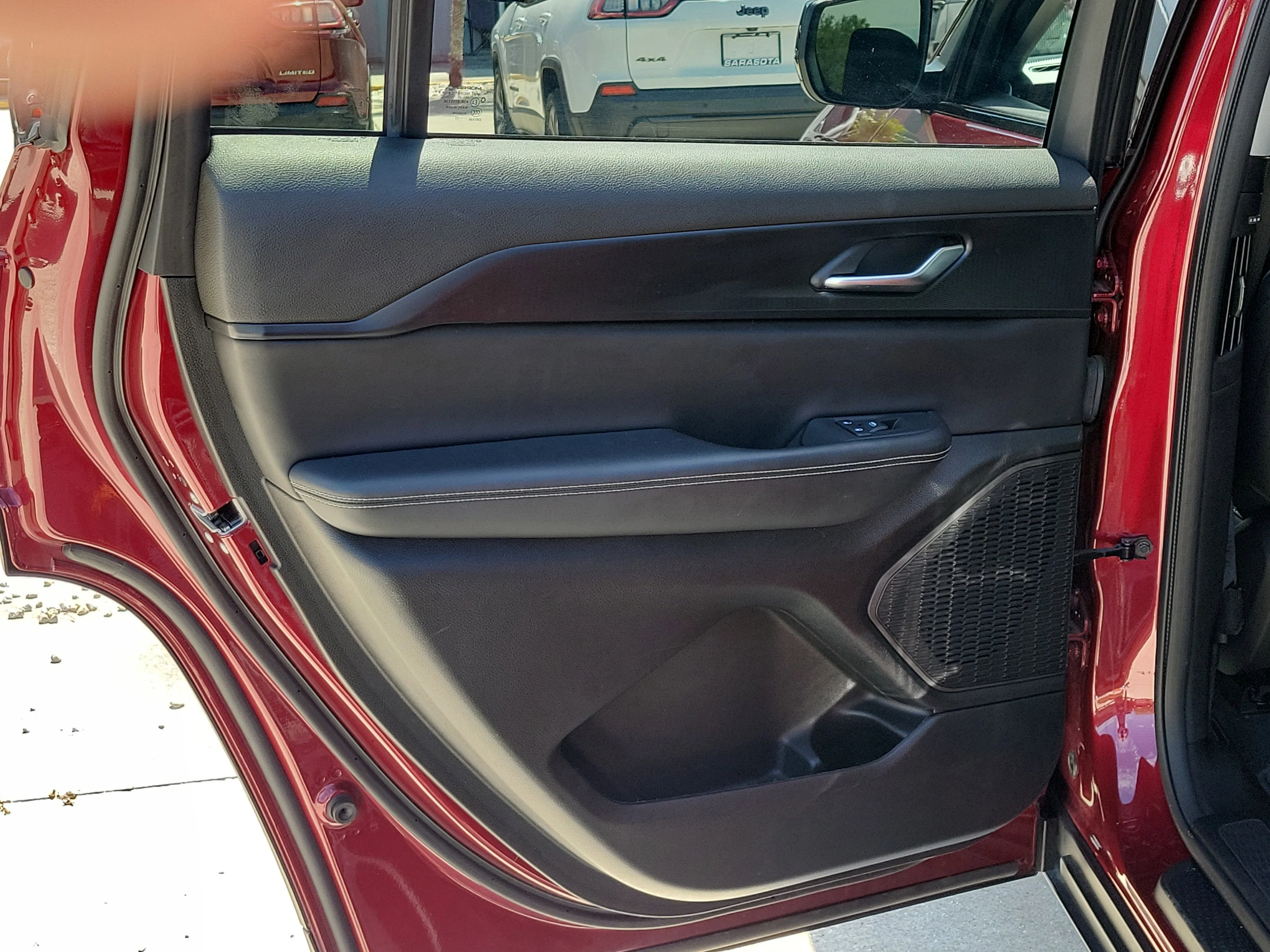 Used 2023 Velvet Red Pearlcoat Jeep Laredo image 13