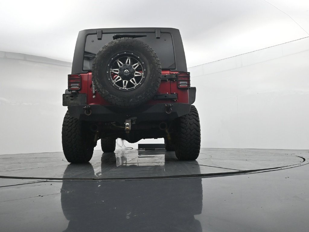 Used 2012 Red Jeep Unlimited Sport image 21