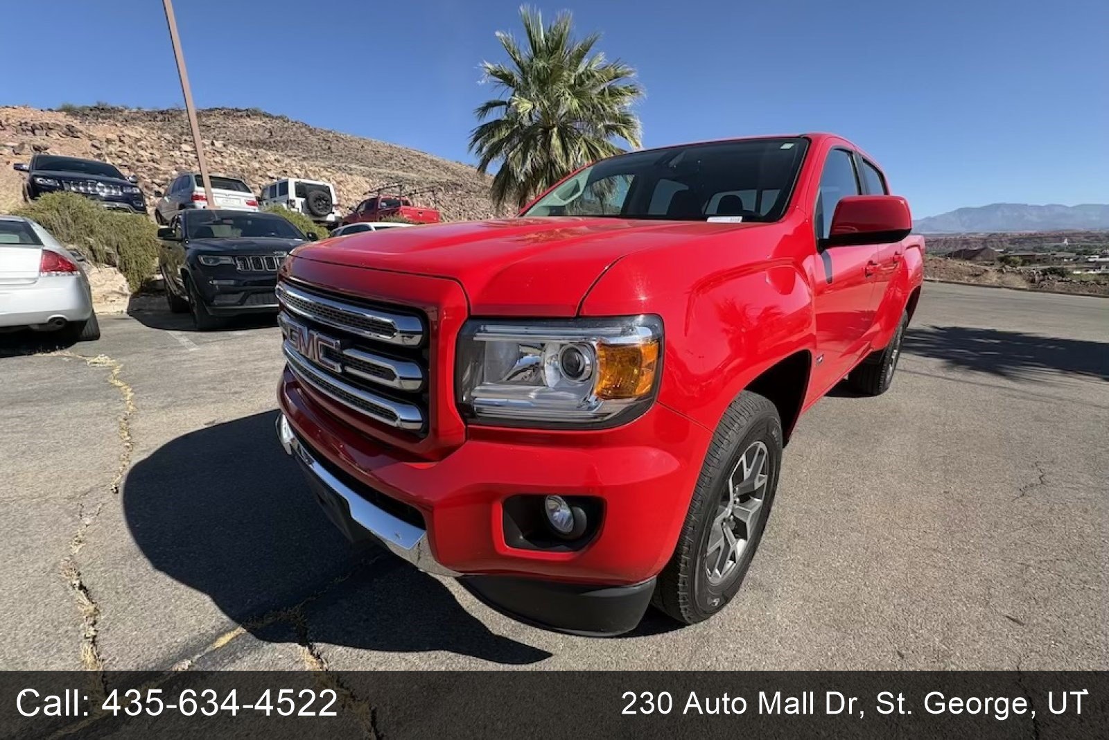 Used 2016 Cardinal Red GMC 4WD SLE image 1