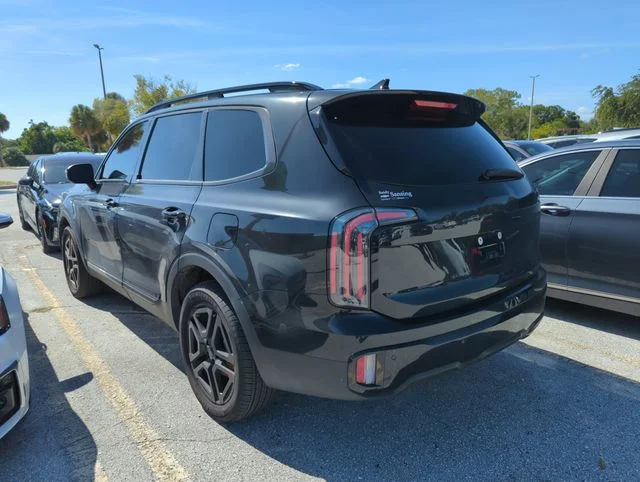 Used 2025 Black Kia EX X-Line image 3