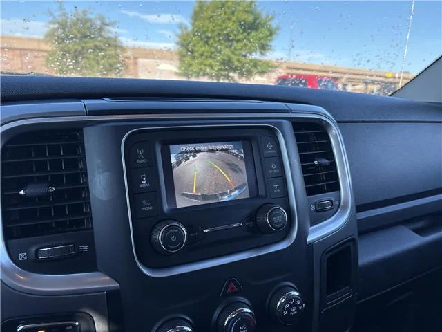 Used 2024 Granite Crystal Metallic Clearcoat RAM SLT 4x4 Quad Cab 6.3 ft. box 140 in. WB image 21