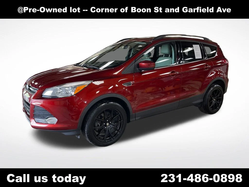 Used 2014 Orange Ford SE image 1