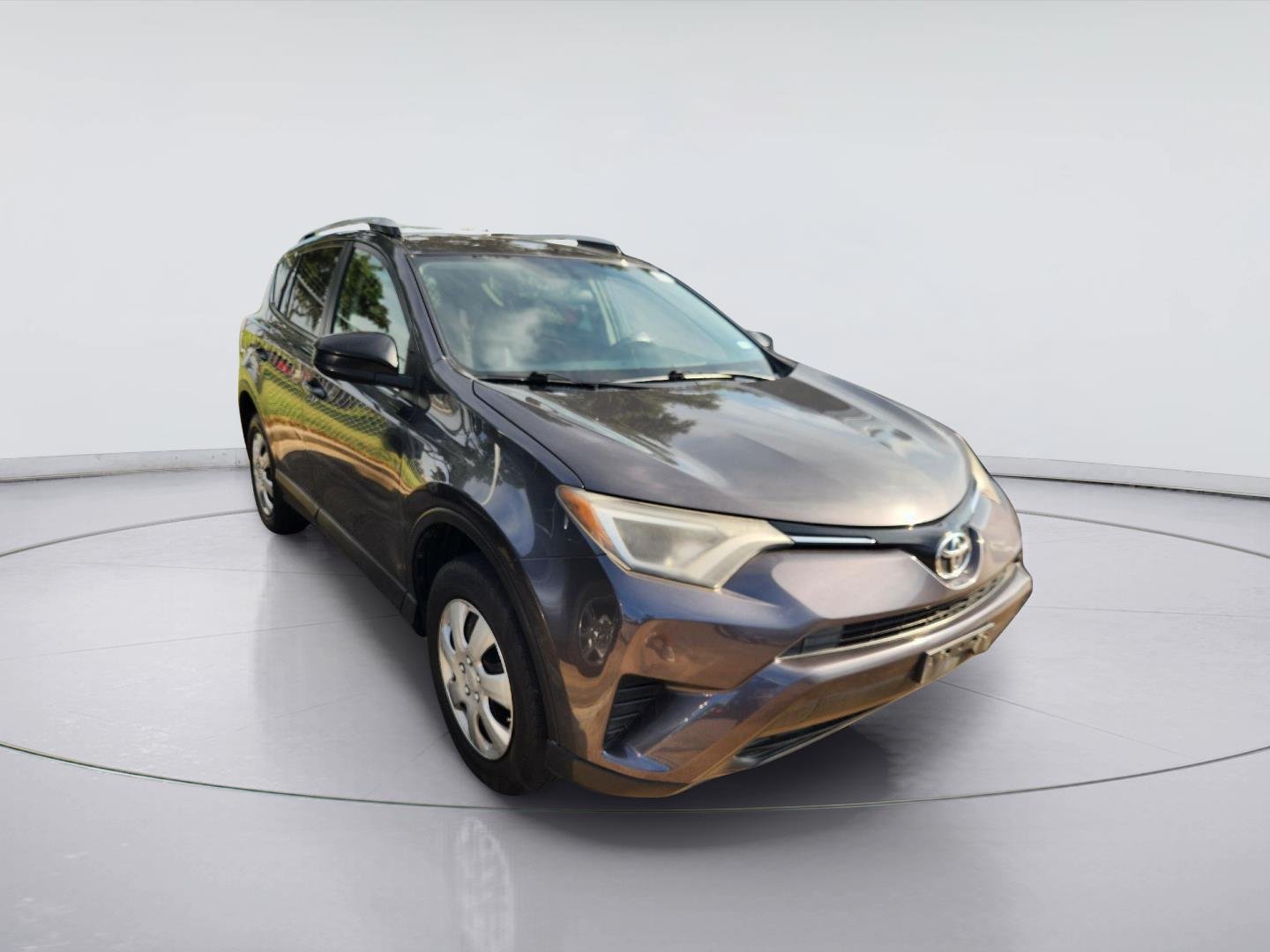 Used 2016 Magnetic Gray Metallic TOYOTA  image 1