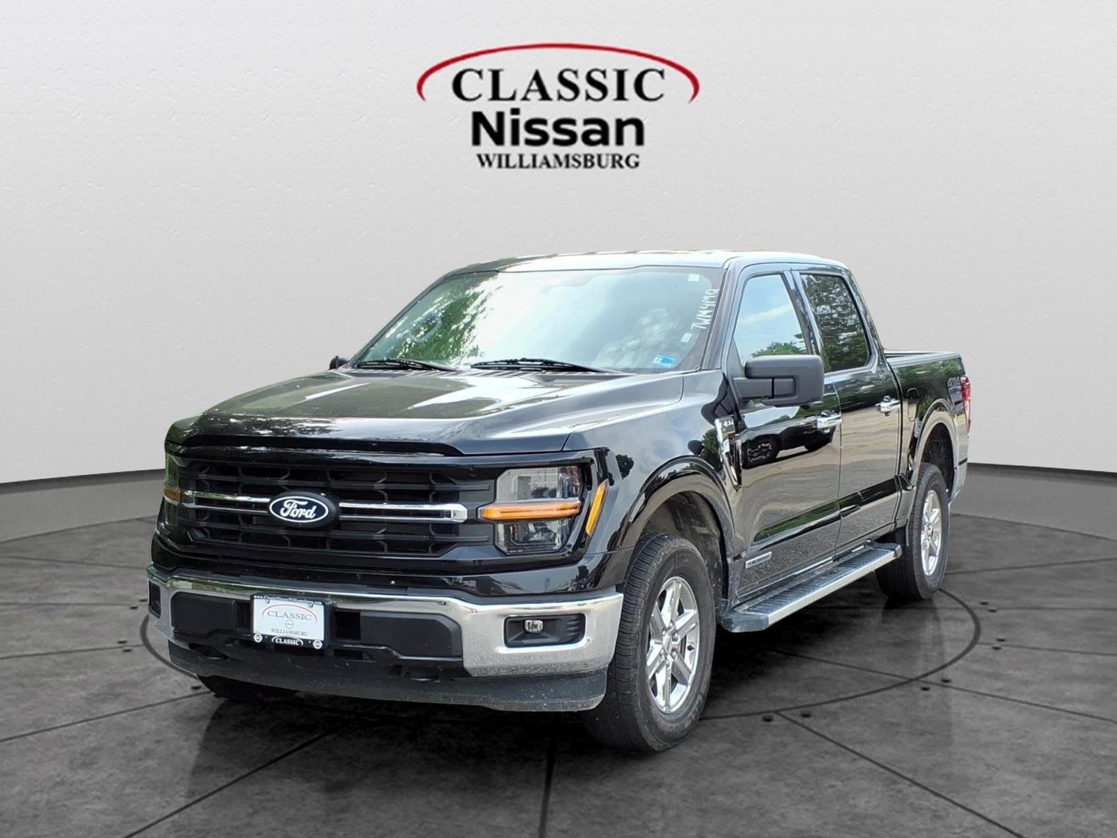 Used 2024 Agate Black Metallic Ford XLT image 1