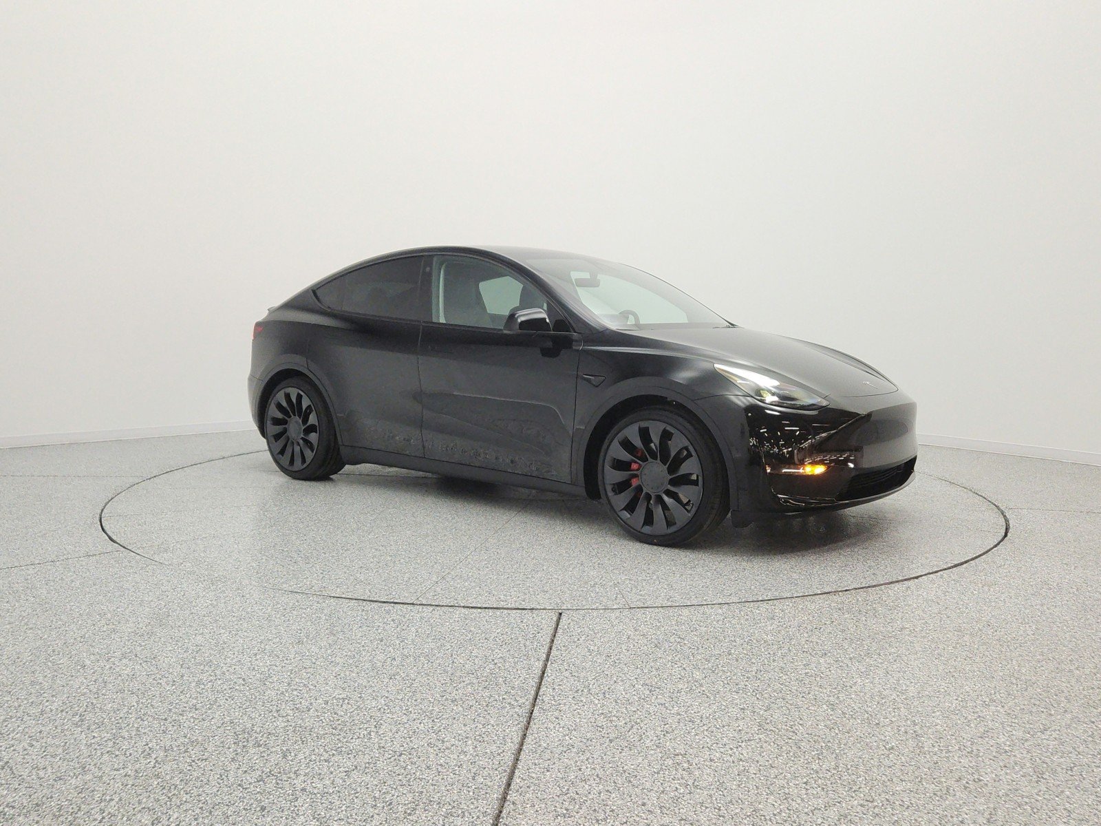 Used 2022 Solid Black Tesla Performance AWD image 3
