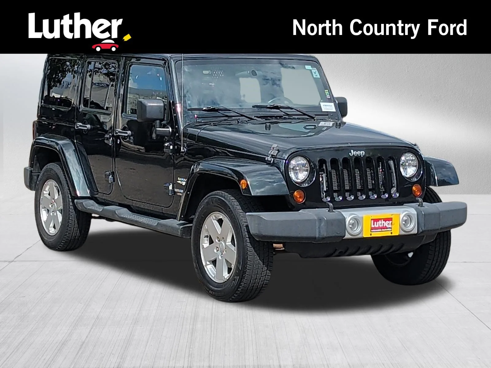 Used 2012 Black Forest Green Pearlcoat Jeep Sahara image 1