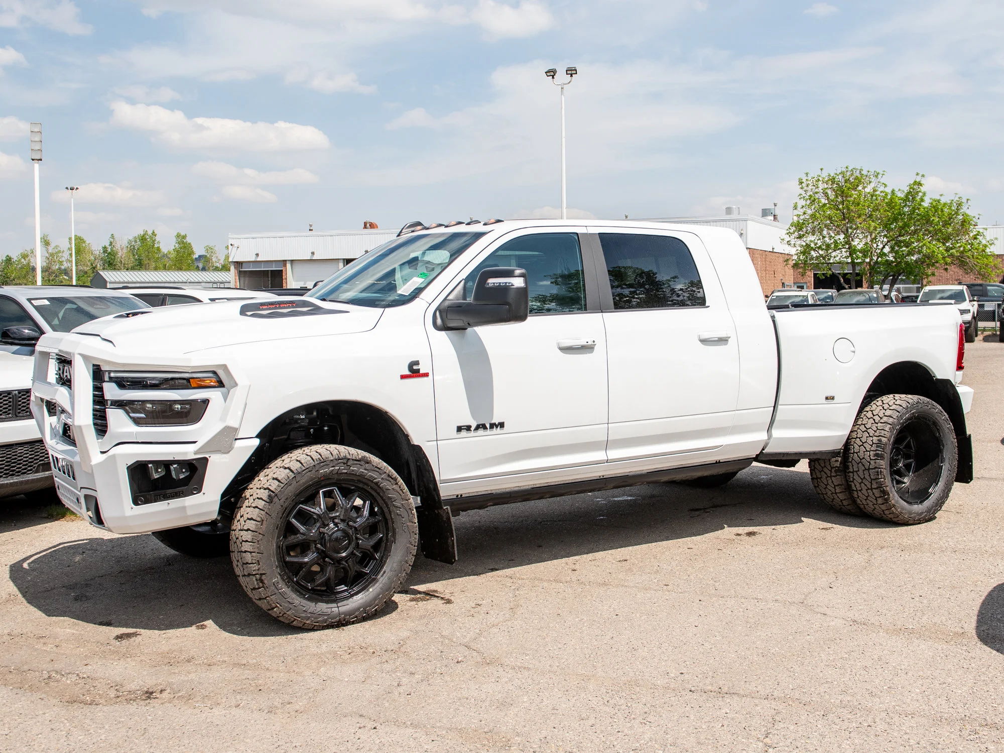 New 2026 White RAM Laramie* Mega Cab, 2 Inch Lift, 35 Inch Tires, Trigger Industries Bumper image 4