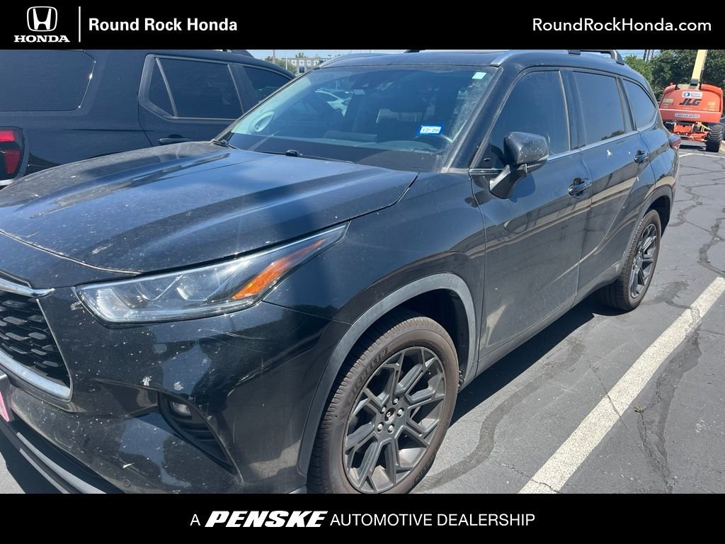Used 2023 Midnight Black Metallic Toyota XLE image 1
