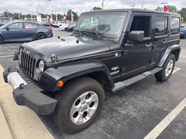 Used 2013 Black Jeep Unlimited Sahara image 1