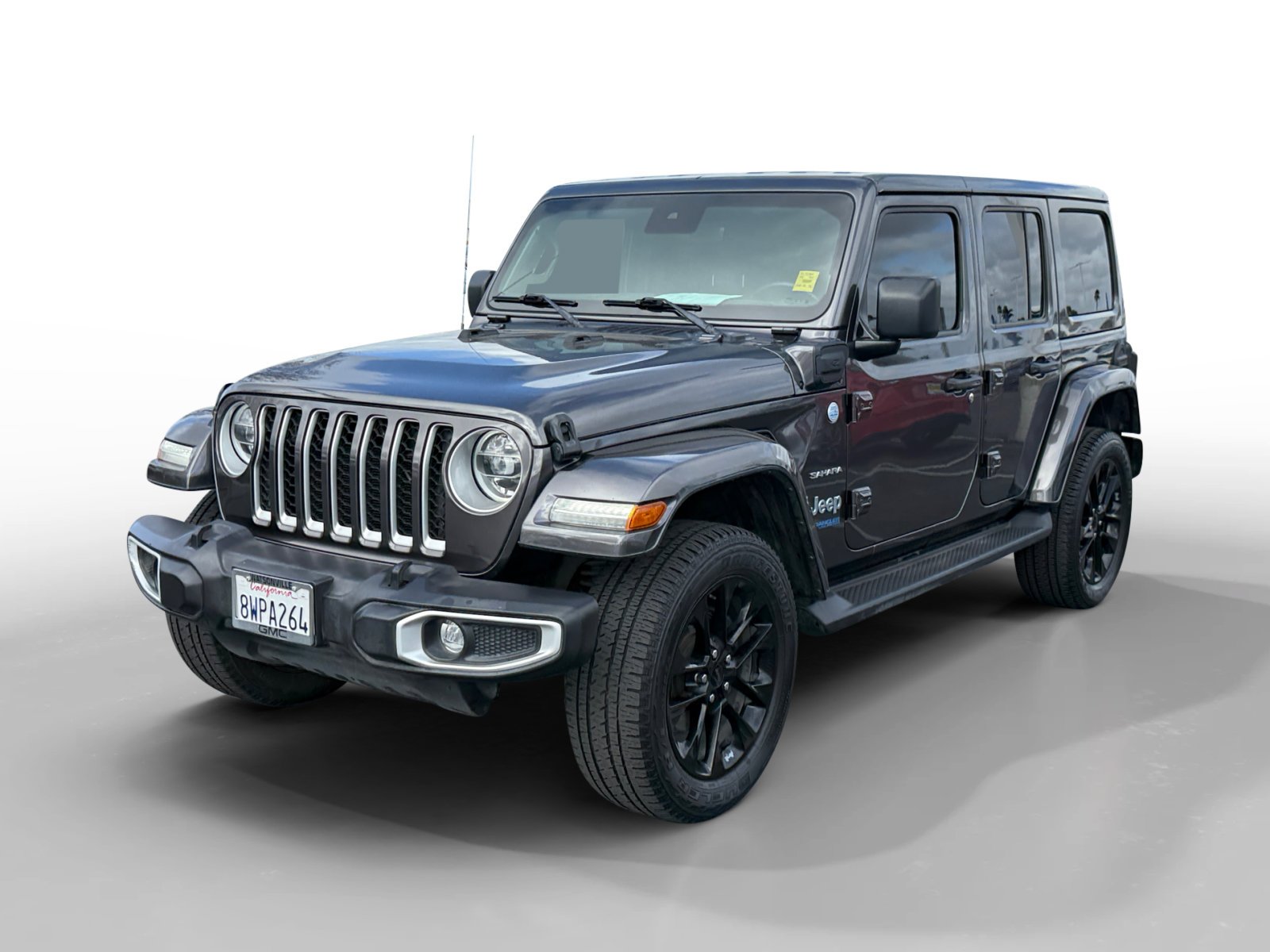 Used 2021 Granite Crystal Metallic Clearcoat Jeep Unlimited Sahara 4xe image 1