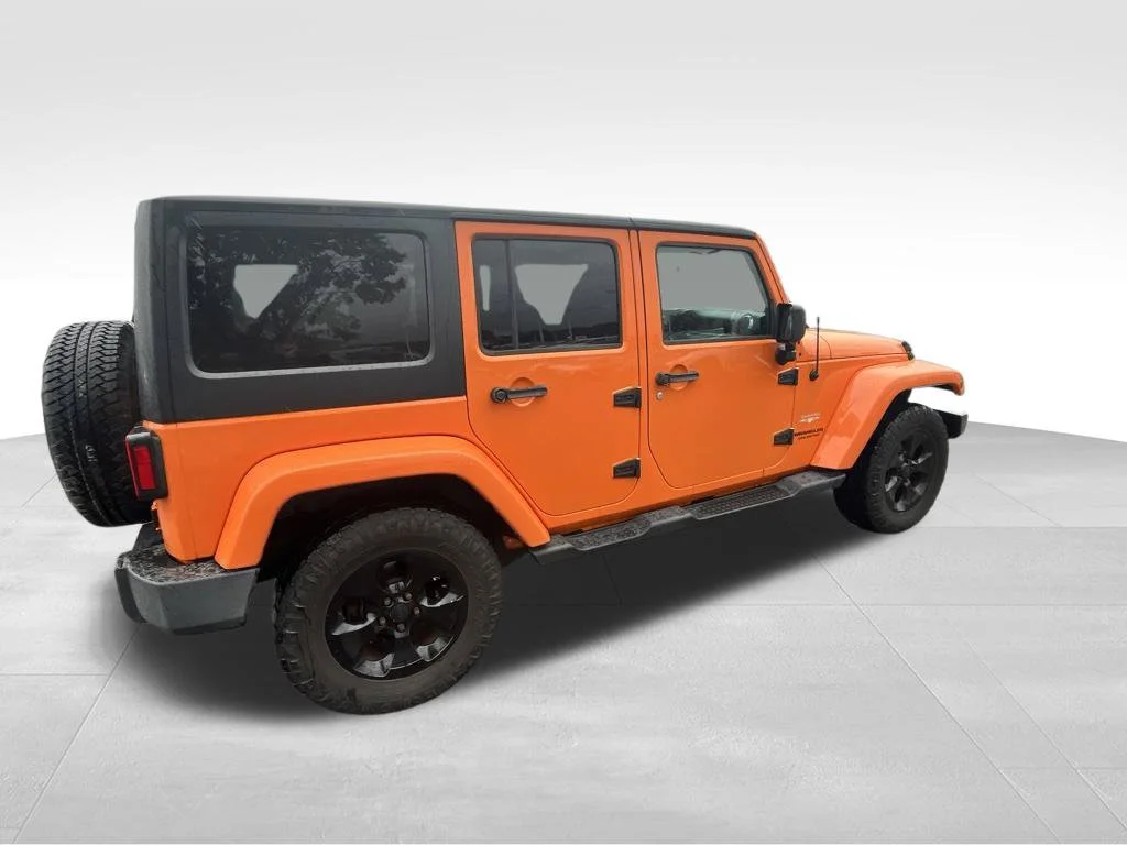 Used 2013 Orange Jeep Unlimited Sahara image 13