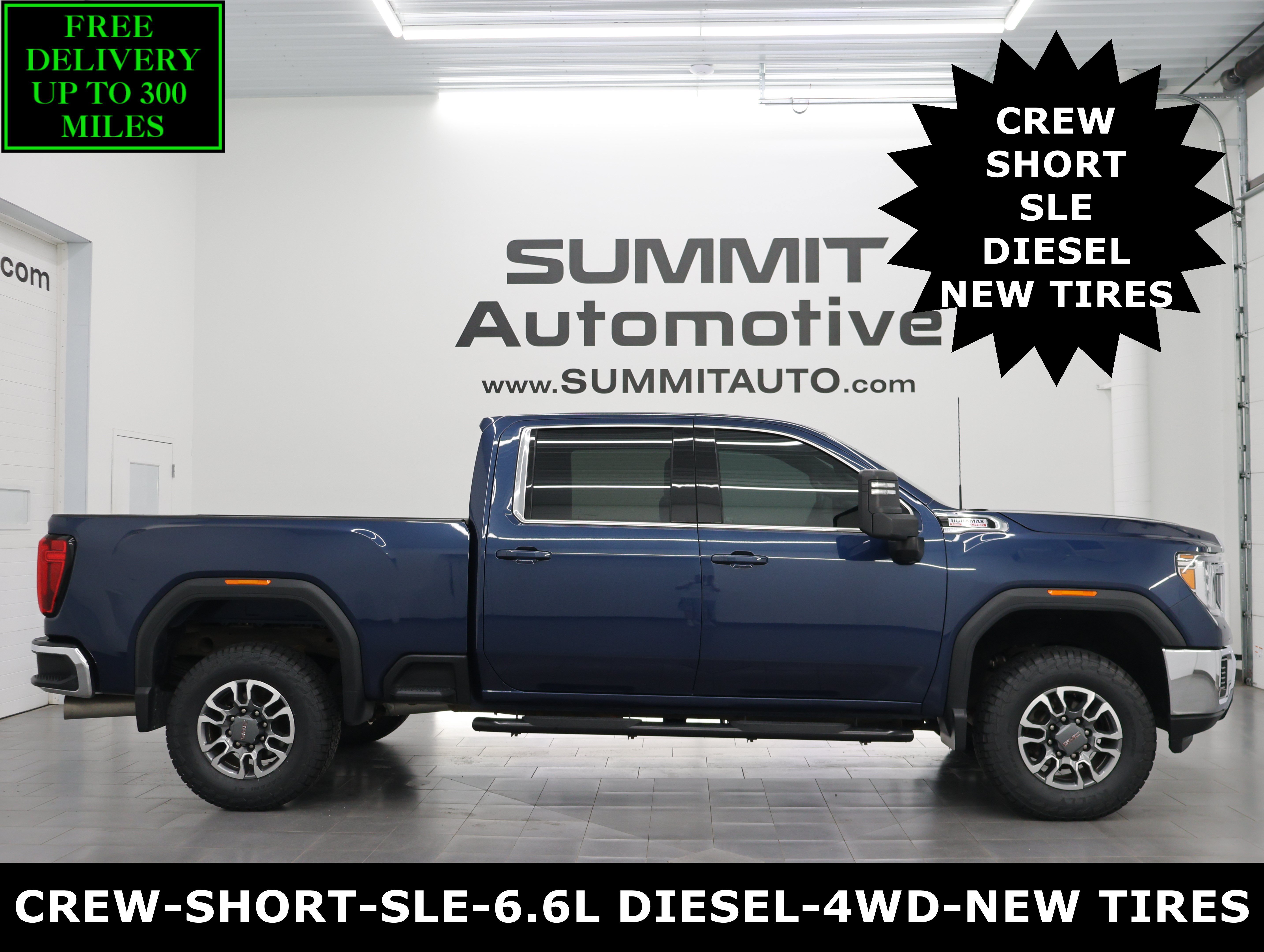 Used 2023 Pacific Blue Metallic GMC 4x4 Crew Cab SLE: CREW-SHORT-SLE-6.6L DIESEL-4WD-NEW TIRES-BACKUP CAM image 1