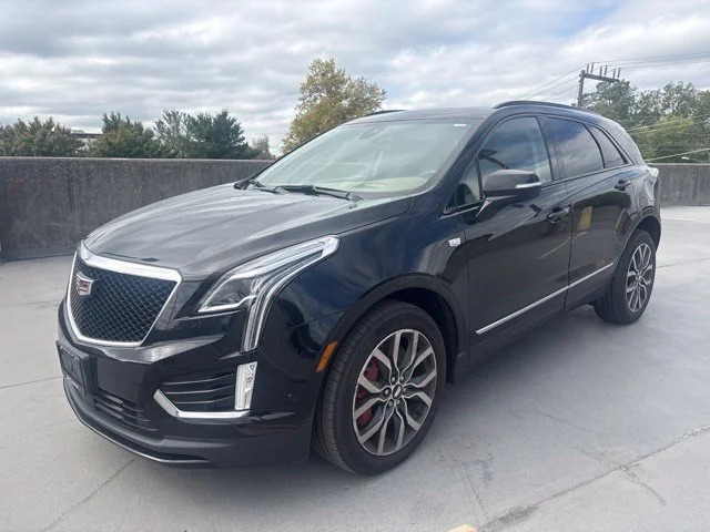 Used 2023 STELLAR BLACK METALLIC Cadillac AWD Sport image 1