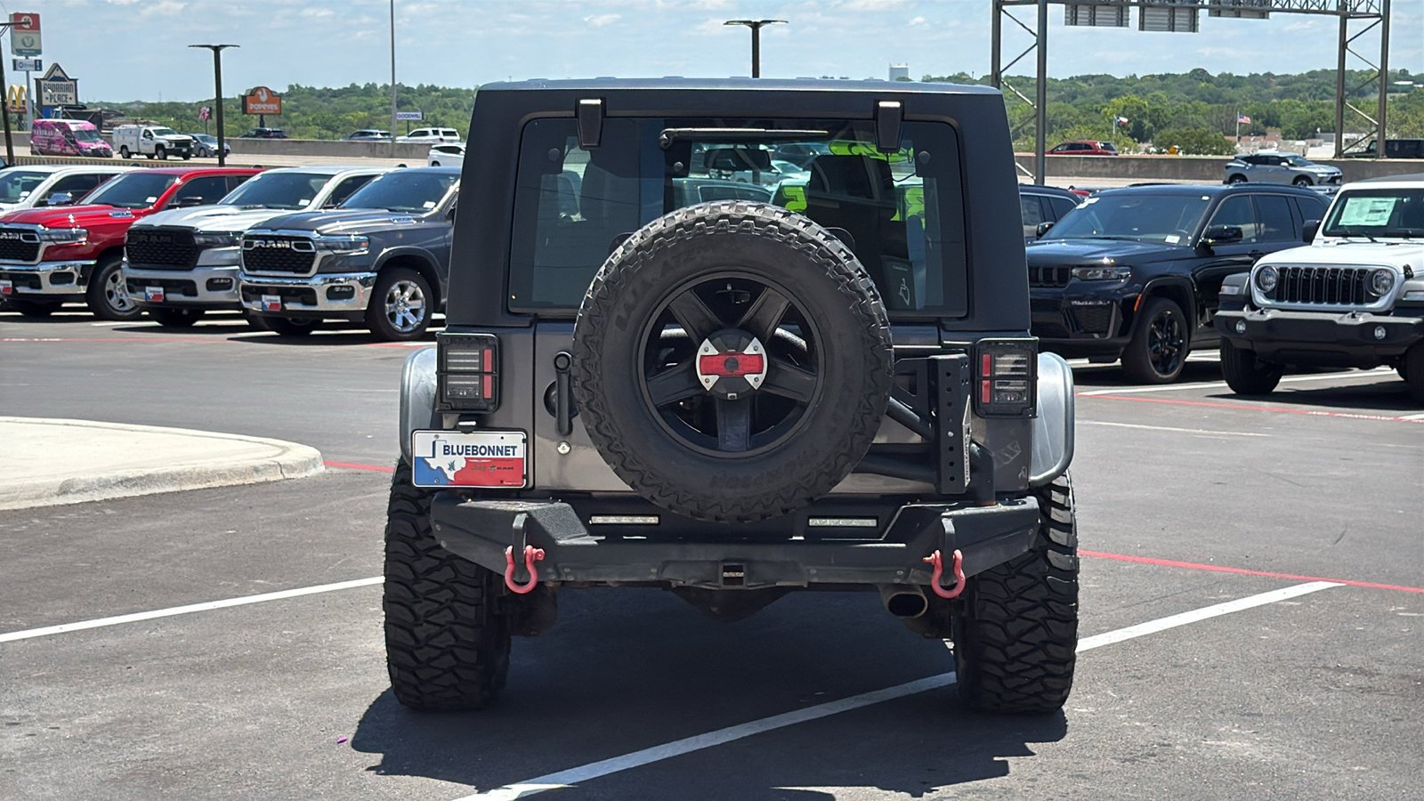 Used 2014 Granite Crystal Metallic Clearcoat Jeep Sport image 4