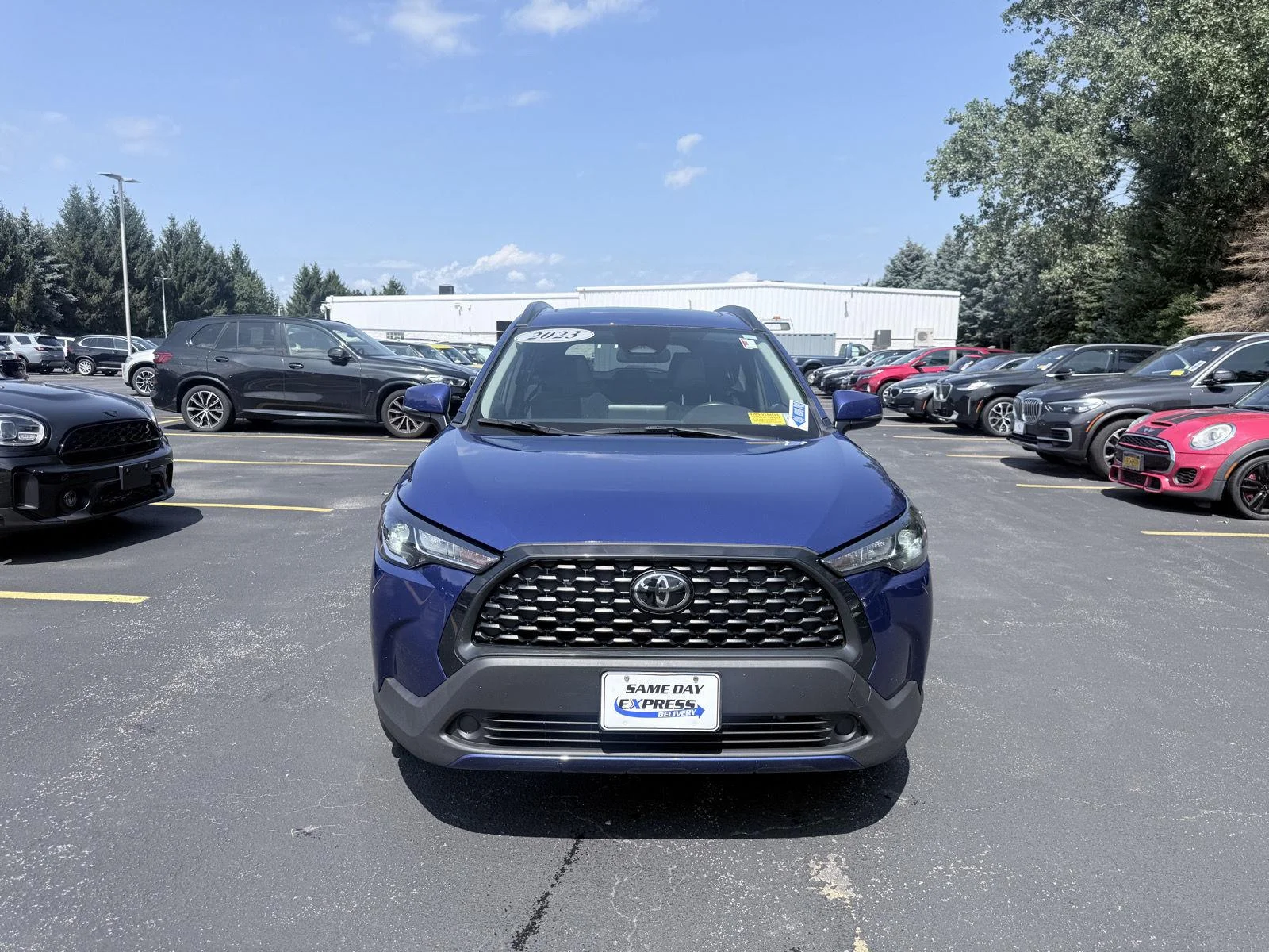 Used 2023 Blue Crush Metallic Toyota LE image 2