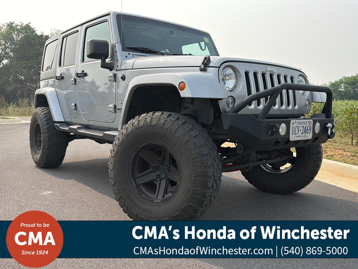 Used 2016 Billet Silver Metallic Clearcoat Jeep Sahara image 1
