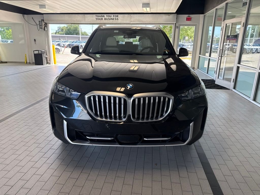 Used 2024 Black BMW sDrive40i image 1