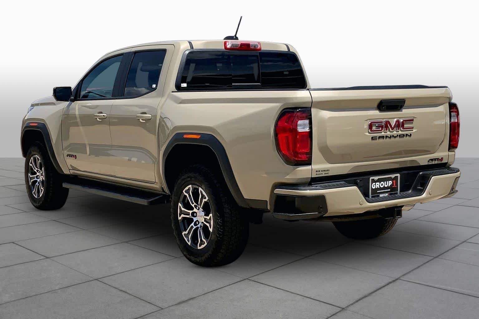 Used 2024 Desert Sand Metallic GMC 4WD AT4 image 12