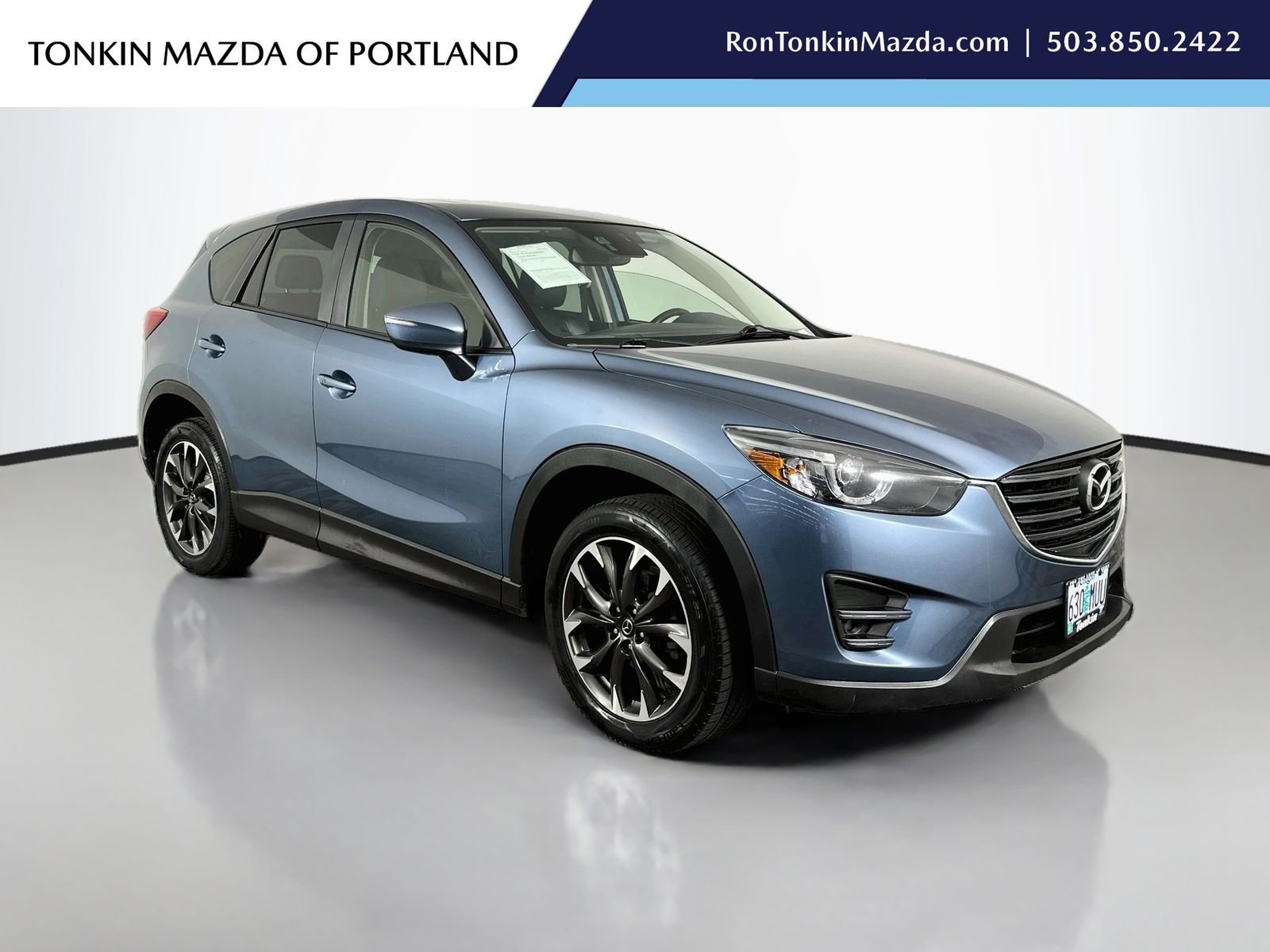 Used 2016 Blue Reflex Mica Mazda Grand Touring image 1