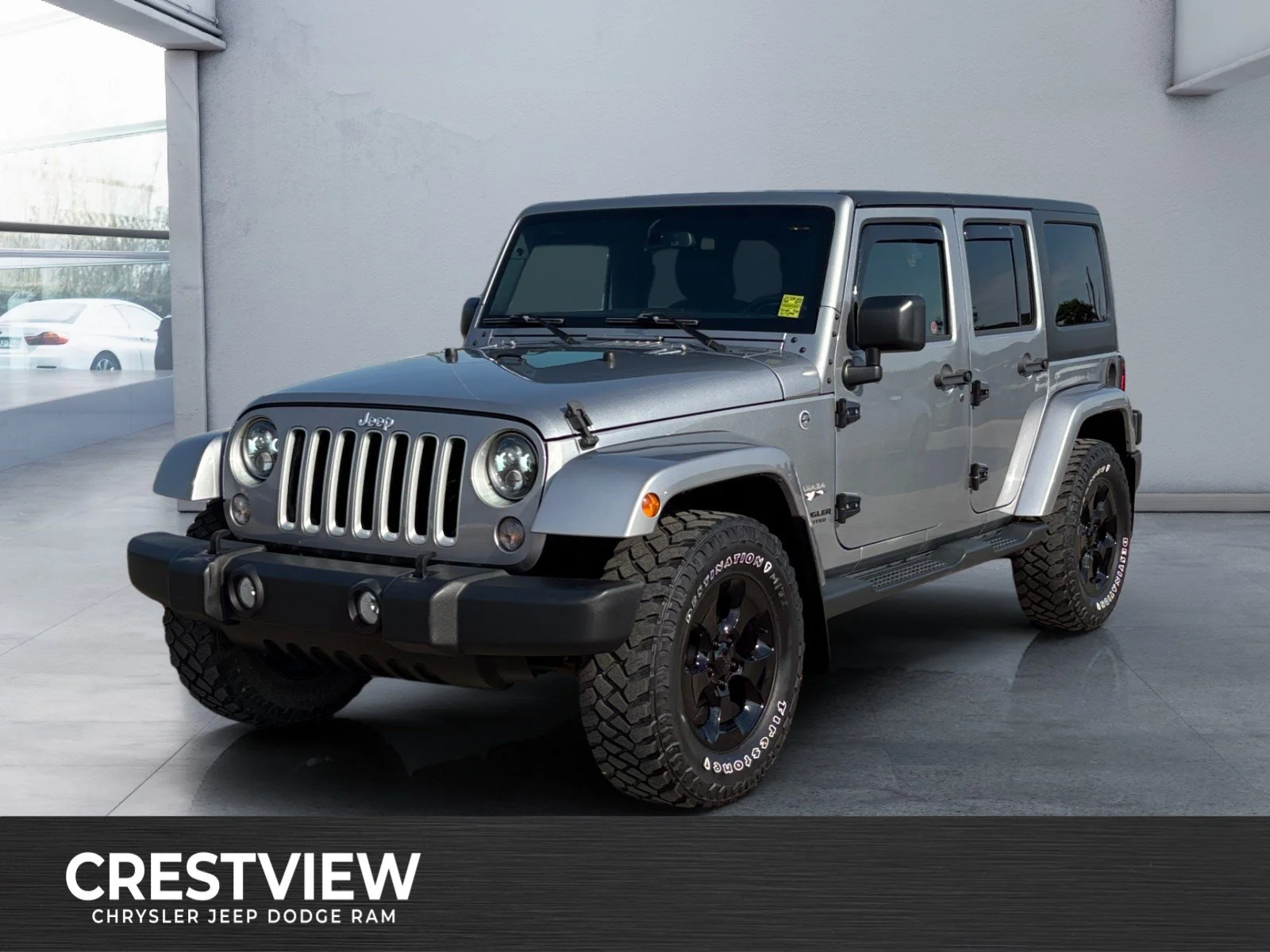 Used 2016 Silver Jeep Sahara image 1